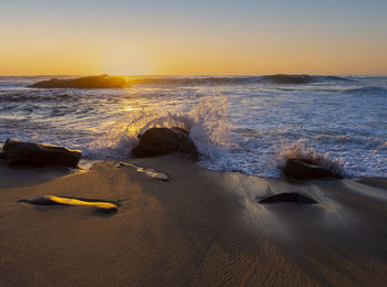 Scenic view of sea against sky during sunset