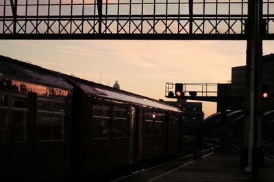 Train at railroad station against sky