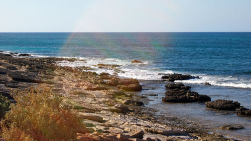 Scenic view of sea against clear sky