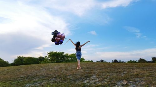 Woman jumping on grass