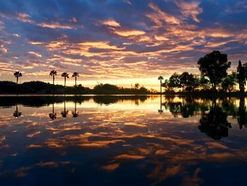 Scenic view of lake against sky during sunset