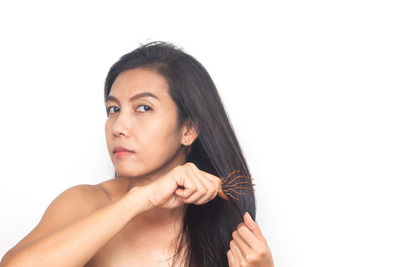 Portrait of a beautiful young woman over white background