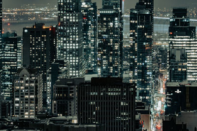 Illuminated buildings in city at night