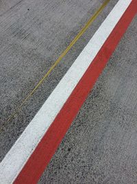 Full frame shot of road with colored line