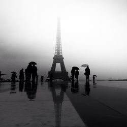 Silhouette of woman walking in city