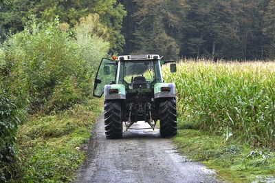 Tractor on the country road, transportation and mobility in agriculture