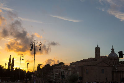 Low angle view of buildings against sky during sunset