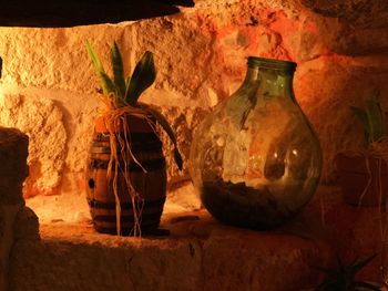 Old weathered bottles on wall