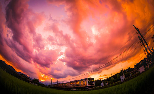 Low angle view of dramatic sky during sunset