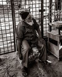 Midsection of woman sitting on floor