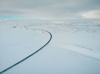 Aerial view of landscape against sky during winter