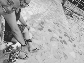 Low section of woman sitting on floor