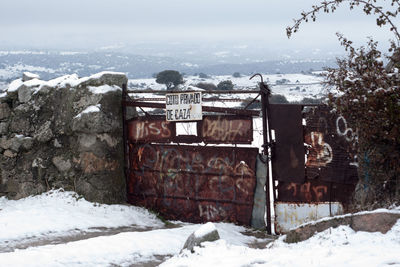 Built structure in winter against sky