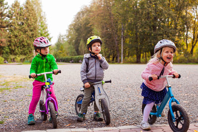 Siblings riding bicycle