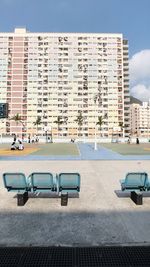View of swimming pool against buildings in city