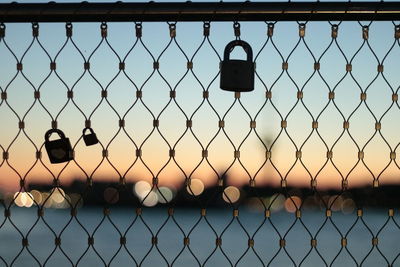 Close-up of chainlink fence against clear sky