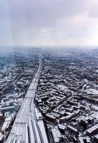 High angle view of city during winter against sky