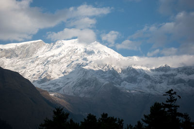 Scenic view of snowcapped mountains against sky