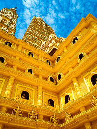 Low angle view of historical building against blue sky