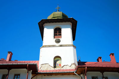 Low angle view of building against blue sky