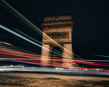 Blurred motion of light trails on road at night