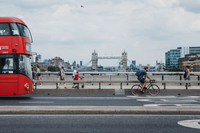 People riding bicycle on city street