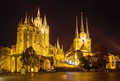 Illuminated buildings in city at night