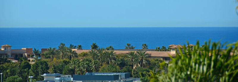 Scenic view of sea against clear blue sky