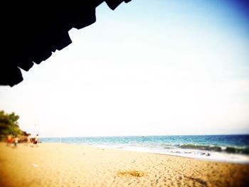 Scenic view of beach against clear sky