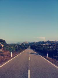 Empty road against sky