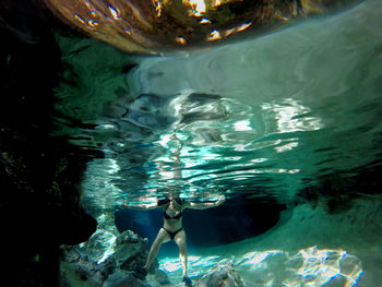 Woman swimming in sea