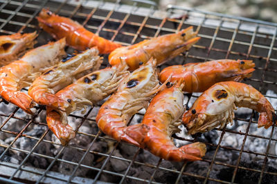 High angle view of meat on barbecue grill