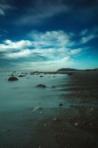 Scenic view of sea against blue sky