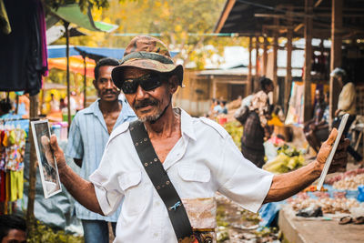 Midsection of man in market