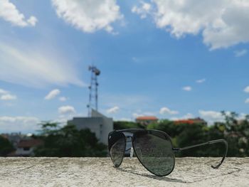 Close-up of sunglasses against clear sky