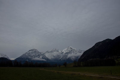 Scenic view of snowcapped mountains against sky