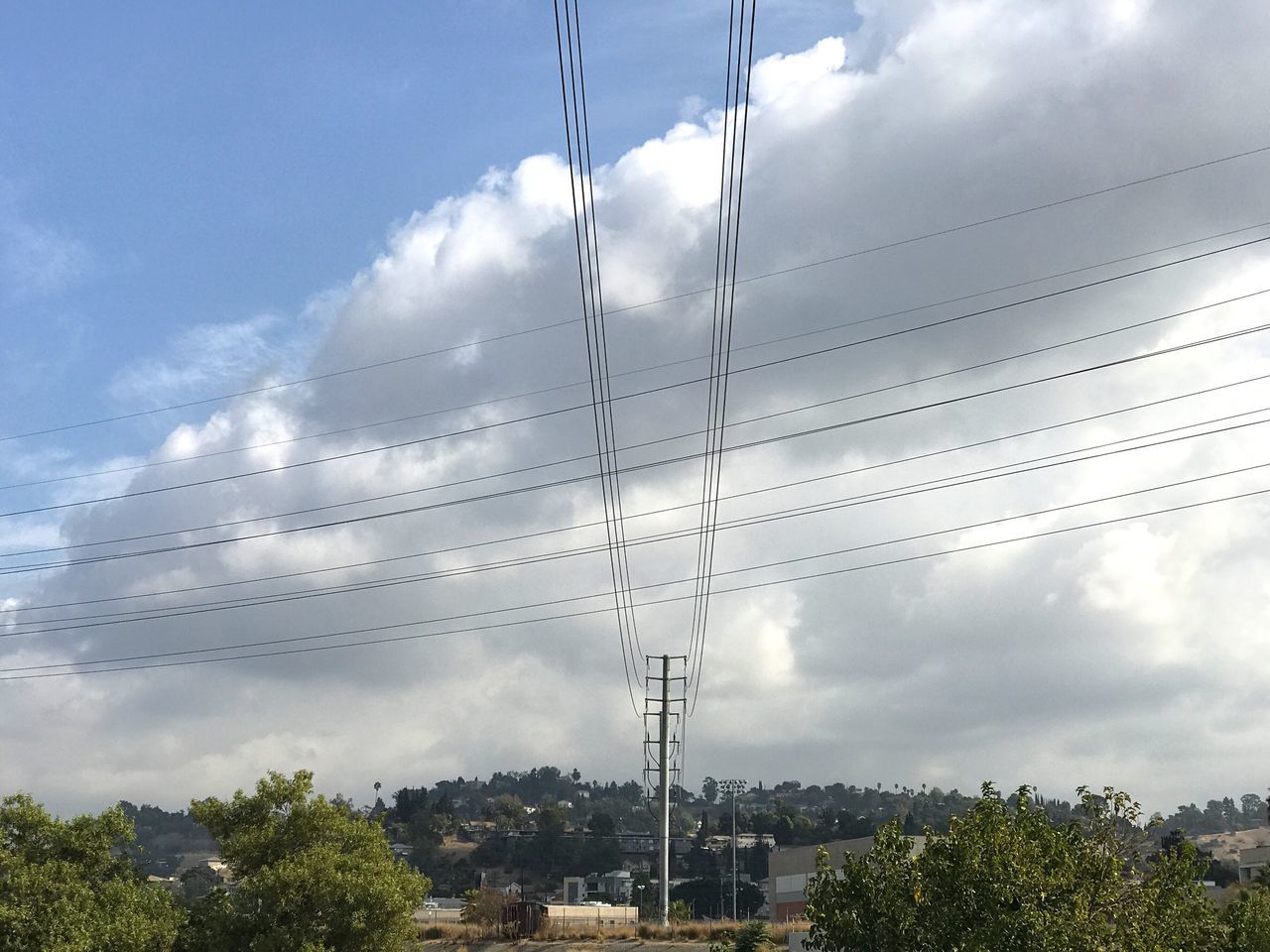cable, sky, cloud - sky, tree, power line, power supply, electricity, fuel and power generation, connection, electricity pylon, day, low angle view, no people, nature, technology, outdoors, telephone line, beauty in nature