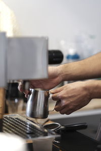 Hand holding coffee cup