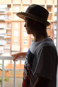 Midsection of young man looking away