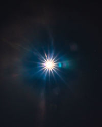 Low angle view of illuminated sky at night