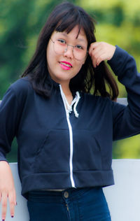 Portrait of smiling girl standing outdoors