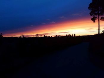 Silhouette landscape against sky during sunset