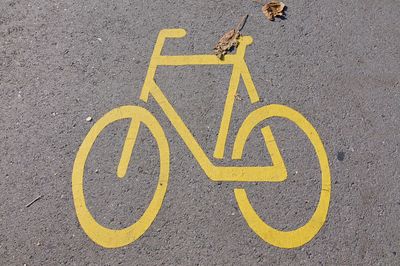 High angle view of arrow sign on street