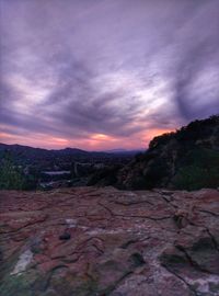 Scenic view of landscape against dramatic sky