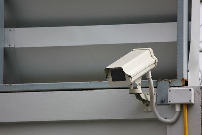 Cctv camera on cement wall
