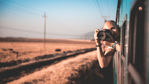 Portrait of man photographing