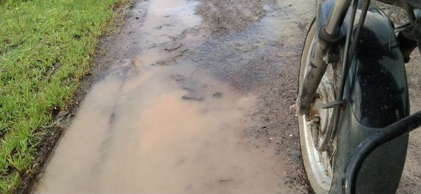 High angle view of tire tracks on road