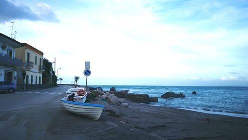 Man in sea against sky