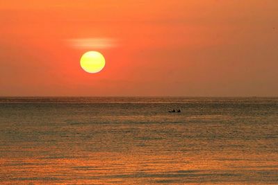 Scenic view of sea at sunset