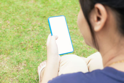 Young woman using phone